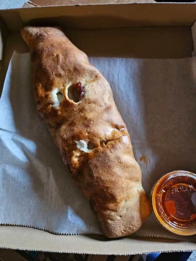 Personal Sausage, Pepper, Onions, & Roasted Pepper Stromboli.